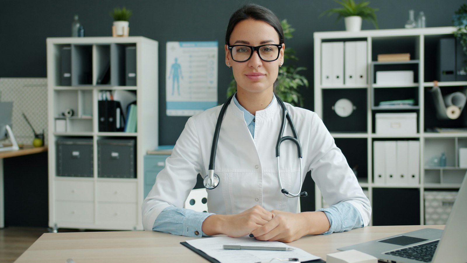 Friendly female doctor at her desk